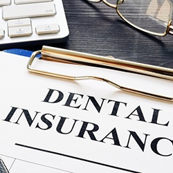Dental insurance paperwork for the cost of dental implants in Lincoln