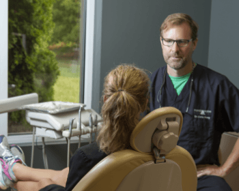 Dr. Chris speaking with female patient