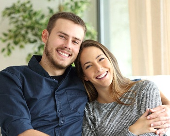 confident couple smiling after a smile makeover in Lincoln