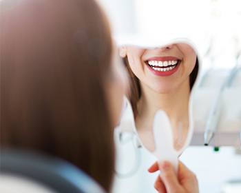 woman's smile in mirror