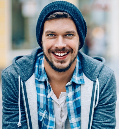 man with hat smiling