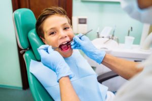 child getting an exam for rare oral health problems