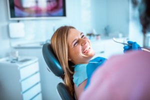 woman smiling in the dentist’s chair